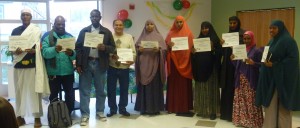 From left to right the students with earned English Learning Certificates are Abdi Barre, Issak Hassan, Hussein Malin, Ronald Solis, Fadumo Nur, Zem Zem Yusuf, Rukhia Yusuf, Habibo Mohamed, Kimiya Iman, and Maryama Gele. Photos by Jenne Nelson